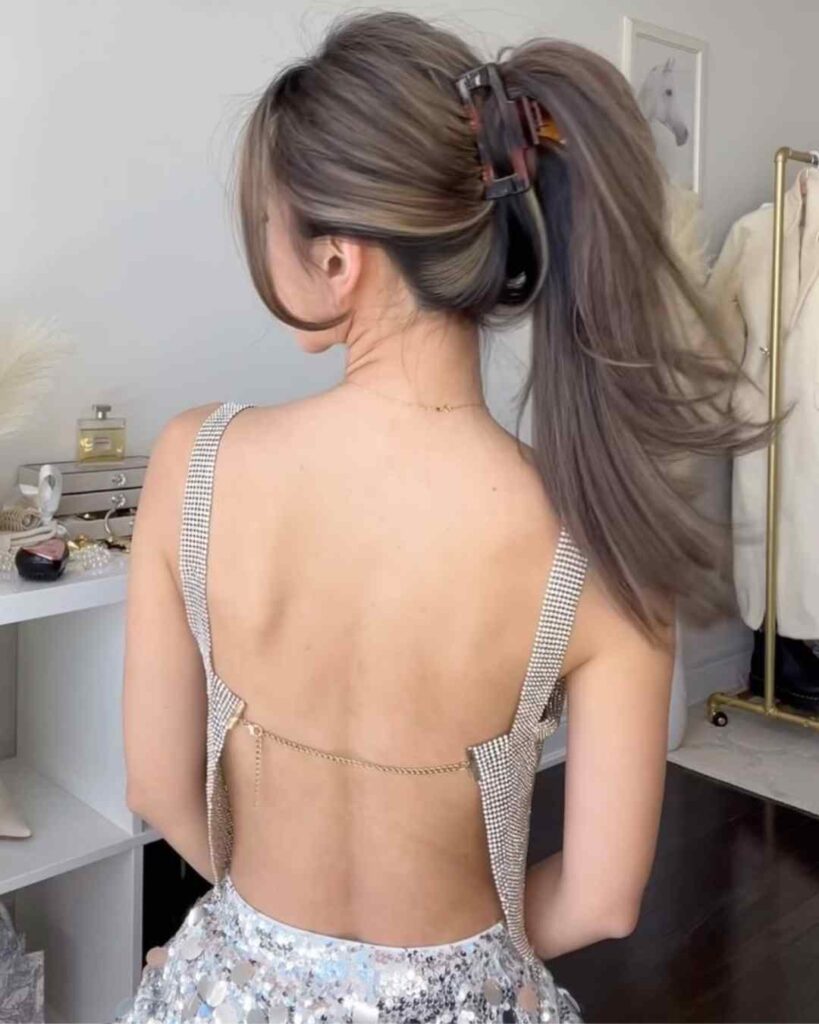 The Sleek Low Ponytail with a Statement Clip