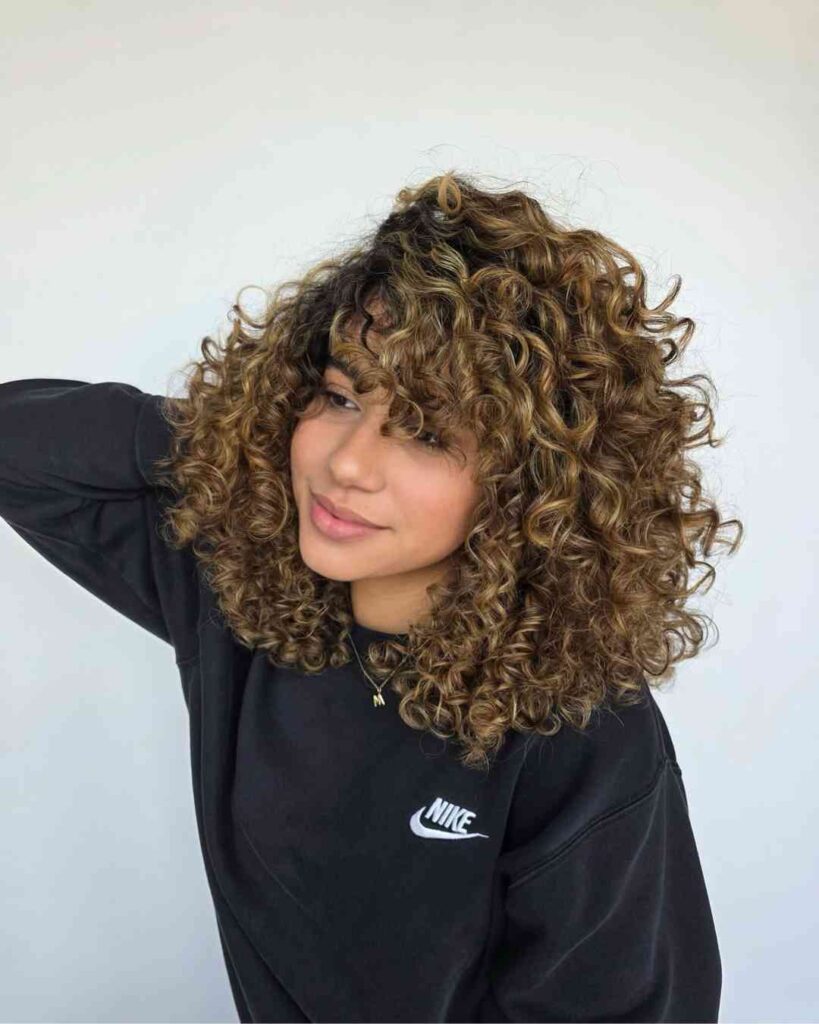 17. Golden Highlights on Natural Curls
